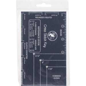 May include: A blue plastic cross stitch guide with a ruler, corner guide, and cloth counter. The guide includes floss strand and needle size reference charts.