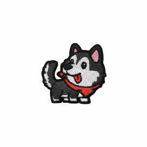 May include: Embroidered patch featuring a cartoon husky dog with black, white, and red accents. The dog is wearing a red bandana and has its tongue sticking out. The patch is designed with a playful and friendly aesthetic.