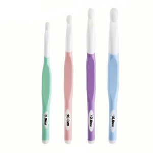 May include: Set of four crochet hooks in different colors and sizes: 8.0mm (light green), 10.0mm (light pink), 12.0mm (light purple), and 15.0mm (light blue).