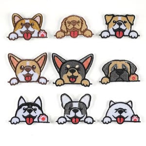 May include: Nine embroidered dog patches in various breeds, each with a unique color scheme and expression. The dogs are depicted peeking over a line, with their tongues sticking out. The patches are white, brown, black, and tan.