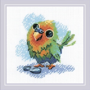May include: Cross-stitch of a cartoon bird with large eyes, orange chest, and green and blue feathers. The bird is standing on a blue surface with two seed-like shapes. The background has blue cross-stitch details.