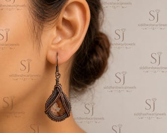 Fossiele oorbellen van ammoniet, met koperdraad gewikkeld, handgemaakte sieraden