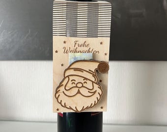 May include: A wooden wine bottle holder with a Santa Claus design and the text "Frohe Weihnachten".