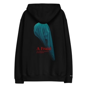 May include: Black hooded sweatshirt with a blue and green graphic of a ghost and the text "A Fraid. The collective noun for a group of ghosts."