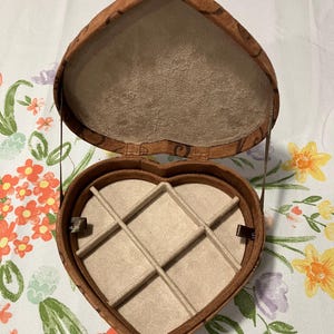 May include: A set of three ceramic mugs with a speckled, matte finish. The mugs are in shades of cream, light gray, and dark gray. Each mug has a simple, minimalist design, perfect for coffee or tea.