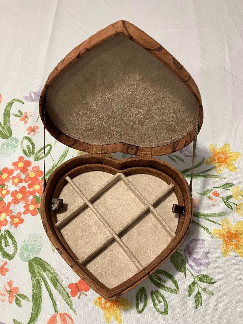 May include: A set of three ceramic mugs with a speckled, matte finish. The mugs are in shades of cream, light gray, and dark gray. Each mug has a simple, minimalist design, perfect for coffee or tea.