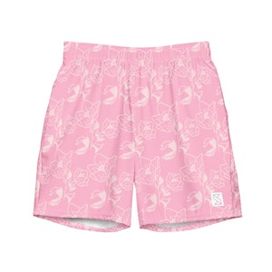 May include: Pink athletic shorts with a white floral pattern. The shorts have a drawstring waistband and a small logo on the right leg.
