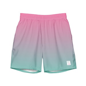May include: Pink and teal ombre athletic shorts with a small logo on the right leg.