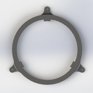 May include: A gray metal speaker ring with three mounting points. The ring is designed to fit around a speaker and secure it in place.