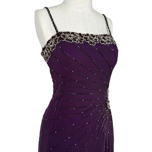 Front-right view of the purple beaded bodice and upper skirt on a mannequin.