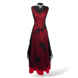 red dress with black lace overlay Red Dress with black overlay and glitter velvet designs  Best fits  XS-S imo SOLD (Lace bolero not included)  Comment "moo" to claim  3 or  more "moo" comments = bids