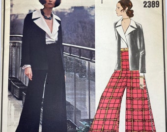 May include: A vintage sewing pattern featuring a black and white outfit with a large collar and a red and black plaid pantsuit. The pattern is from Vogue Original de Paris and is designed by Yves Saint Laurent. The pattern number is 2389.