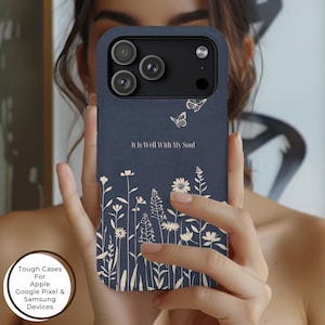 May include: A navy blue phone case featuring a floral design with butterflies and the text "It Is Well With My Soul." The case has a matte finish and is designed for Apple, Google Pixel, and Samsung devices.