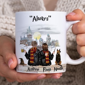 May include: White ceramic mug featuring a watercolour illustration of a snowy Hogwarts castle. Two figures in black robes with red scarves are sitting on a wall with a dog. The text "Always" is at the top of the mug. The names "Andrew, Fiona, Neville" are at the bottom of the mug.