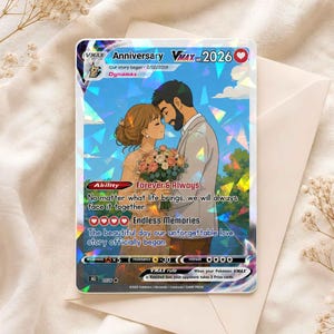 May include: A rectangular trading card with a holographic finish featuring an illustration of a couple in wedding attire holding a bouquet. The card displays text including Anniversary VMAX 2026, Forever & Always, and Endless Memories, set against a blue sky background with clouds and trees.