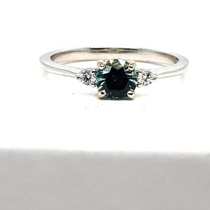 Montana Sapphire ring with diamond highlight stones