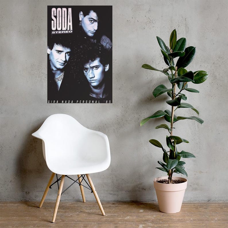 May include: A rectangular black and white poster featuring the band Soda Stereo with the text SODA STEREO and GIRA NADA PERSONAL '85. The poster displays three band members in a portrait style, with high contrast lighting and dark shadows.