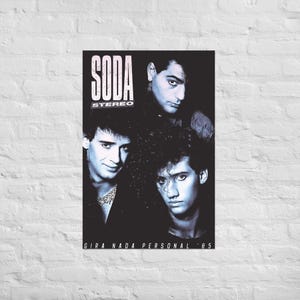 May include: A black and white poster featuring the band Soda Stereo. The text SODA STEREO appears in the upper left corner, and the text GIRA NADA PERSONAL '85 is at the bottom. Three band members are shown in a dark, high-contrast portrait.