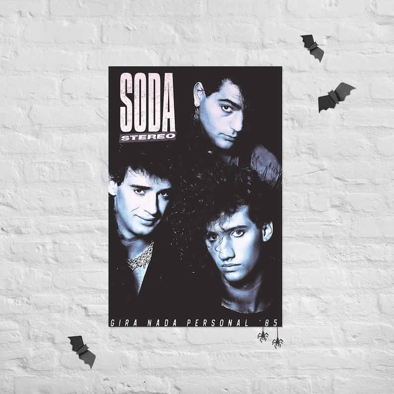 May include: A black and white poster featuring the band Soda Stereo with the text SODA STEREO and GIRA NADA PERSONAL '85. The image displays three band members with 1980s hairstyles, set against a dark background with small bat silhouettes.