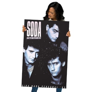 May include: A rectangular poster featuring a black and white photograph of three band members. The text SODA STEREO is printed in the upper left corner, and the text GIRA NADA PERSONAL 85 is printed along the bottom edge of the poster.