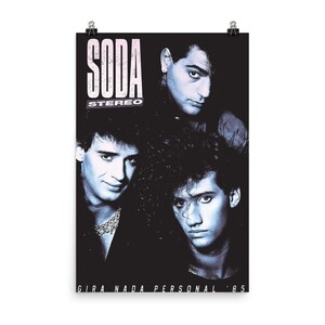 May include: A black and white poster featuring the band Soda Stereo. The text SODA STEREO appears in the upper left corner, and GIRA NADA PERSONAL '85 is printed at the bottom. Three band members are shown in a blue-tinted portrait style.