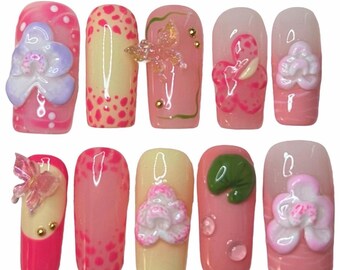 Unghie finte orchidee dipinte a mano, unghie y2k, unghie per le vacanze, unghie artistiche 3D, unghie finte a lunga durata, unghie finte Pinterest, unghie estive, rosa