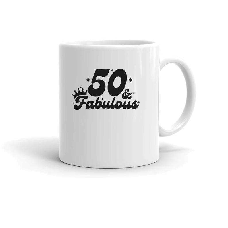 May include: White ceramic mug with a black design that says "50 & Fabulous" with a crown above the 50.