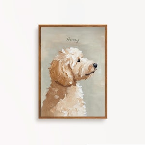 May include: A framed portrait of a golden doodle dog in profile. The dog has fluffy, light brown fur and a black nose. The name "Henry" is written in cursive at the top. The frame is a dark brown color.
