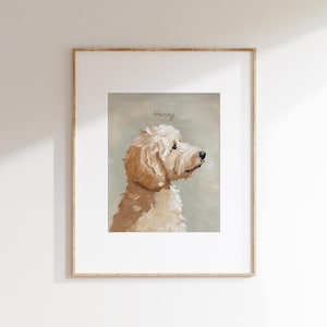 May include: Framed artwork featuring a light brown dog, painted in a soft, painterly style. The dog is depicted in profile, with the name "Henry" written above. The artwork is set against a muted green background.