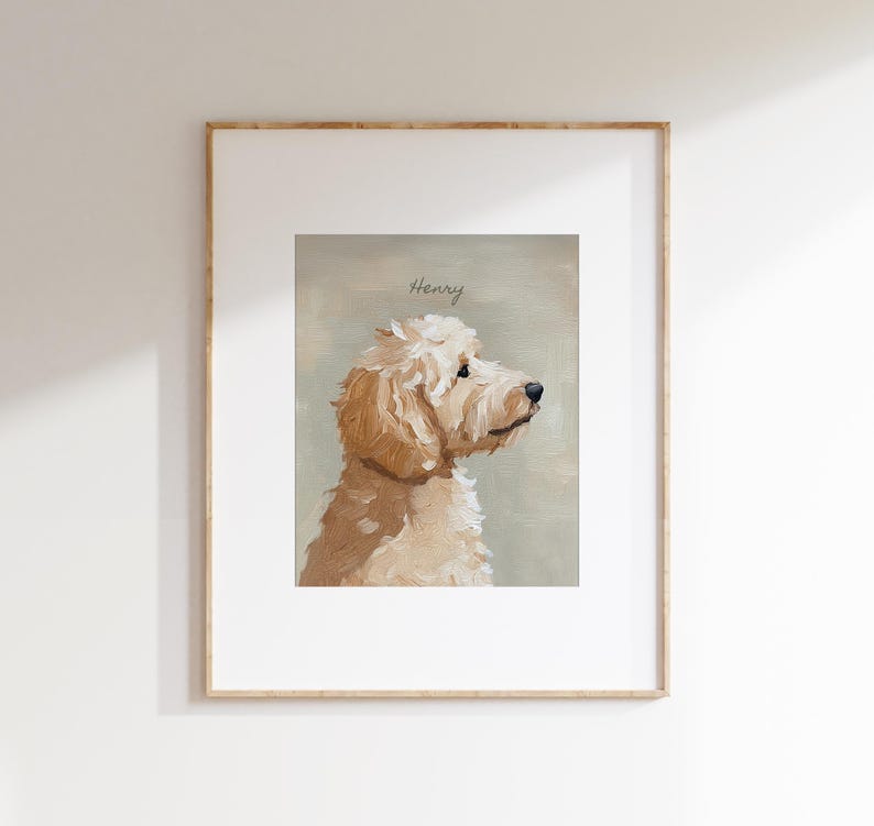 May include: Framed artwork featuring a light brown dog, painted in a soft, painterly style. The dog is depicted in profile, with the name "Henry" written above. The artwork is set against a muted green background.