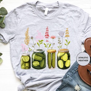 a t - shirt with pickles and flowers on it
