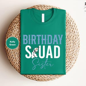 a green birthday t - shirt sitting on top of a wicker basket
