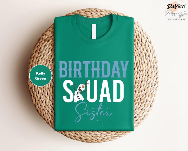 a green birthday t - shirt sitting on top of a wicker basket