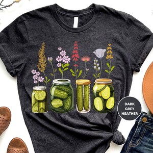 a t - shirt with pickles and flowers on it