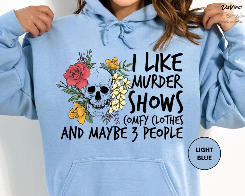 a woman wearing a blue hoodie that says i like murder shows and maybe 3