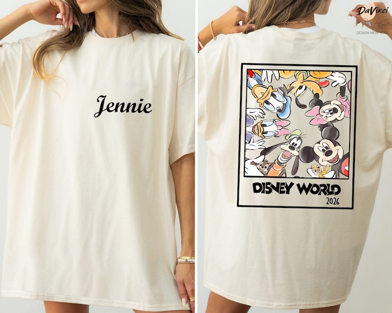 A woman wearing a white t-shirt with a Disney World-themed design on the back.