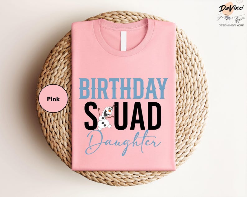 a pink birthday squad shirt sitting on top of a wicker basket