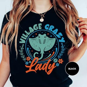 a woman wearing a black vintage crab lady t - shirt