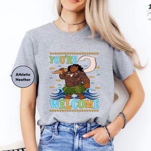 a woman wearing a t - shirt that says you're welcome