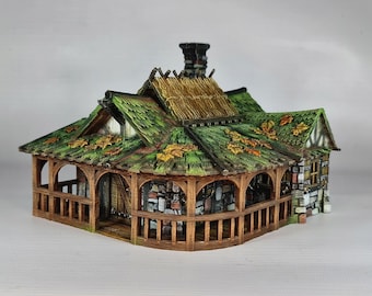 May include: A miniature wooden house with a thatched roof and a green mossy roof. The house has a porch with wooden railings and a stone foundation.
