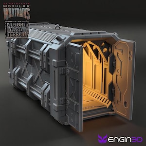 May include: A gray, metal cargo container with a door open, revealing an empty interior. The container has a textured surface and is designed for 3D printing. The text "3D Printable Modular War Trains Freight Yard Terrain" is visible on the container.