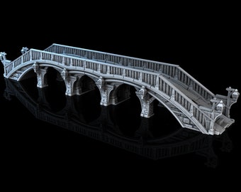 May include: A detailed model of a stone bridge with arched supports and wooden railings. The bridge has decorative lamp posts on either end and is painted in a light gray color.