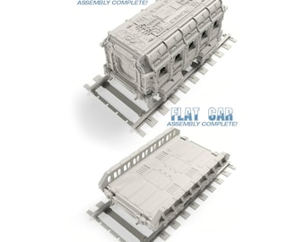 May include: Two 3D printed model train cars, a troop car and a flat car, on tracks. Both cars are gray and have the text "Assembly Complete!" on them.