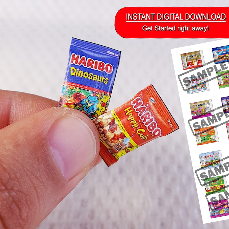 May include: Two miniature packages of Haribo gummy candies. The red package says "Haribo Happy Cola" and the blue package says "Haribo Dinosaurs".