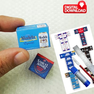 May include: Miniature beer boxes and a can of Modelo beer, a Samuel Adams Boston Lager box, and printed templates for miniature beer boxes. The image also includes a ruler, glue stick, and the text "DIGITAL DOWNLOAD".