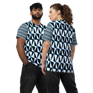 May include: Two people wearing short-sleeved shirts with a geometric pattern of black, white and blue triangles. The shirts have a v-neck and are made of a soft, comfortable fabric.