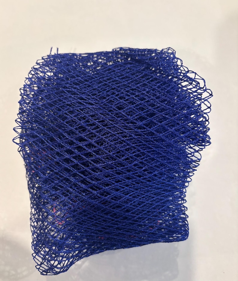 May include: A blue mesh bag with a diamond pattern. The bag is made of a soft, flexible material and is ideal for storing small items.