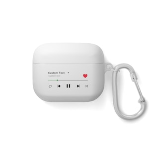 May include: White Airpods case with a red heart and a music player interface. The case has a carabiner clip attached.