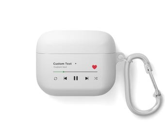 May include: White Airpods case with a red heart and a music player interface. The case has a carabiner clip attached.