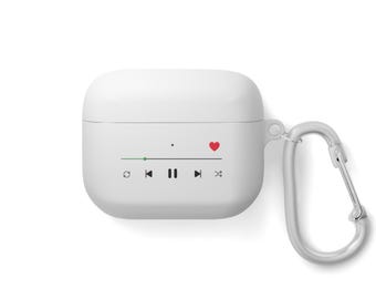 May include: White Airpods case with a red heart and music player controls printed on the front. The case has a silver carabiner attached.